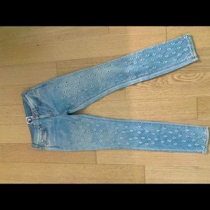 Stylish Versus Versace jeans with holes